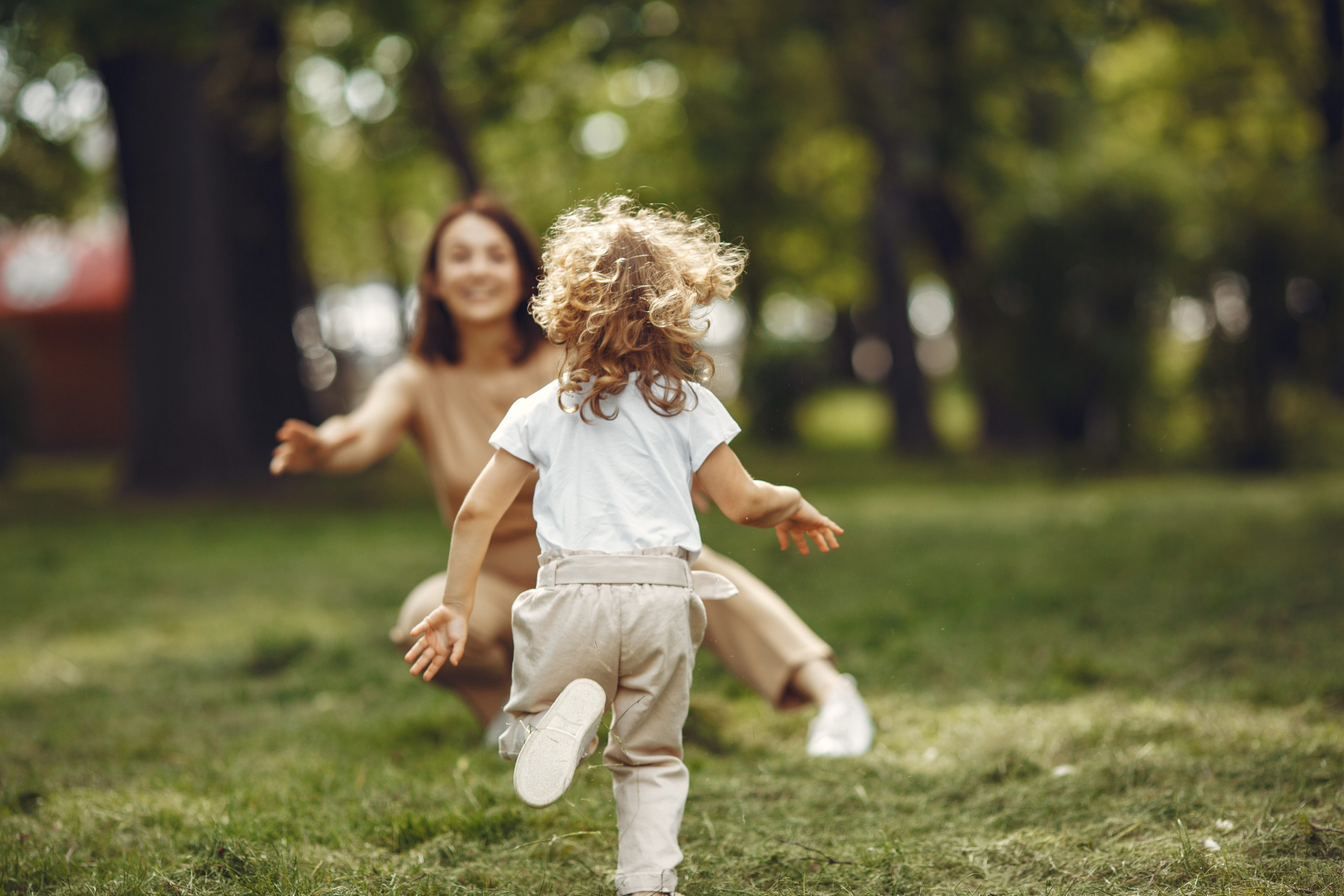 Elegant mother with daughter. Family walks in a forest.